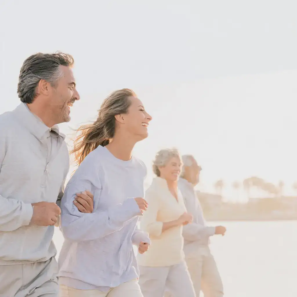 A group of mixed race people in their 70s enjoying a walk alo